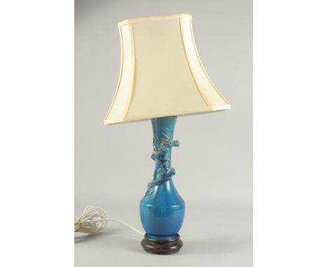 A CHINESE BLUE GLAZED PORCELAIN VASE LAMP, the neck with coiling dragon, vase mounted to a hardwood base, vase: 30cm high.