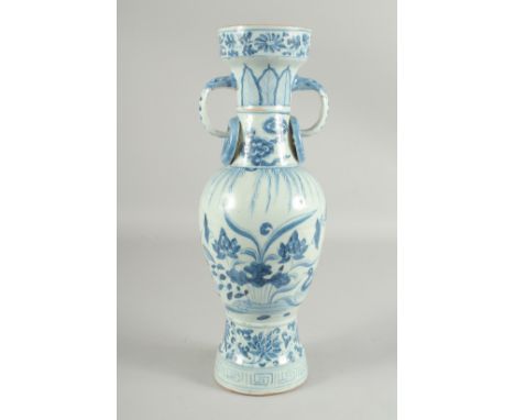 A CHINESE BLUE AND WHITE GLAZED POTTERY TWIN HANDLE VASE, painted with ducks and lotus, 38.5cm high.