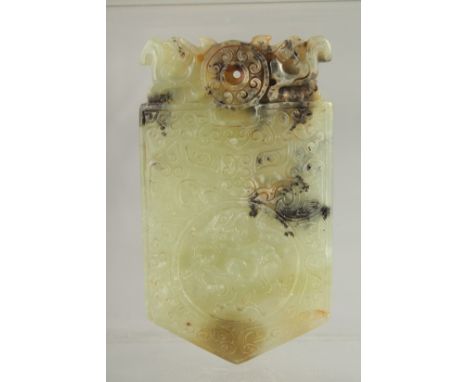 A CHINESE CARVED JADE AMULET, with archaic patterns and dragon, 9.5cm x 5.5cm.