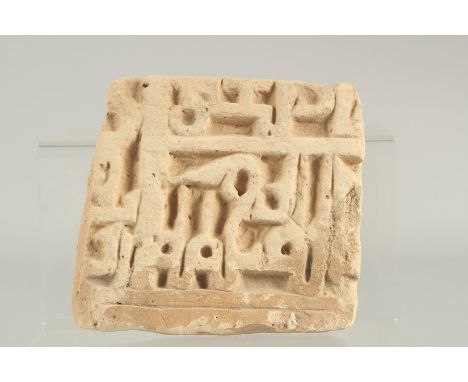 A 14TH CENTURY PERSIAN ILKHANID CARVED POTTERY TILE, with Kufic calligraphy, 15cm x 14cm.