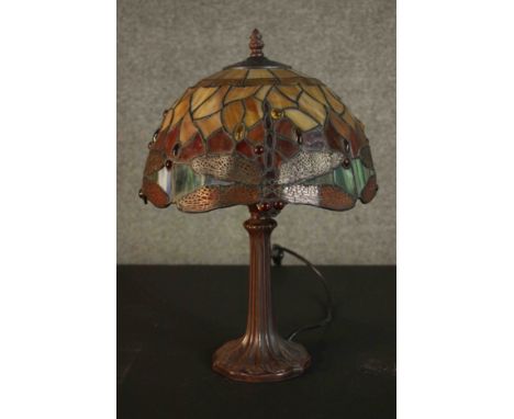 A Tiffany style table lamp, with a stained glass shade on a bronzed base. H.45 Dia.30cm. 