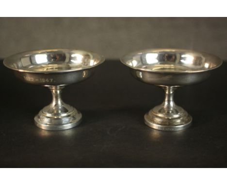 A leather cased set of two weighted sterling silver pedestal tasting cups. Hallmarked: MMH for M M Henderson Ltd of Glasgow, 