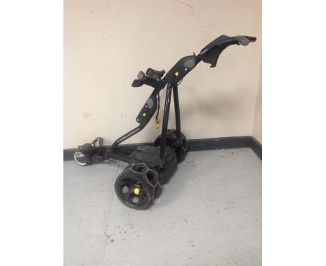 A Powakaddy electric golf bag caddy, together with a barbell.