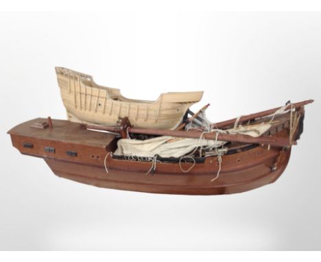 A scale model galleon on stand, plus a further galleon hull, largest 100cm long.