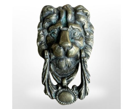 A Victorian brass lion mask door knocker, length 18cm.