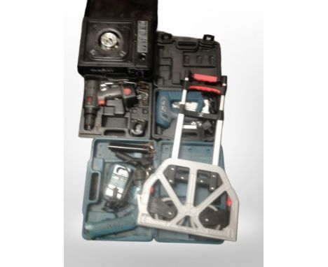 A group of boxed power tools including staple gun, Makita drill, etc. (1 box)