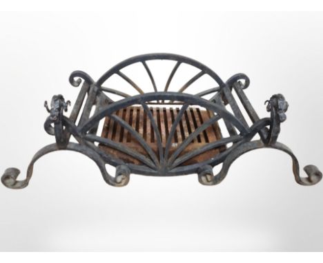 A 19th-century wrought-iron fire grate and pair of firedogs, width 96cm.