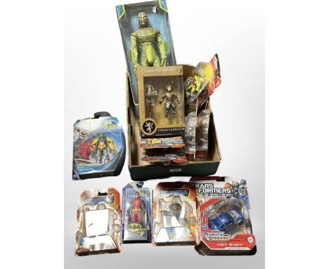 12 Mattel, Spin Master, and other figurines to include DC Universe, Game of Thrones, Transformers, etc., boxed.