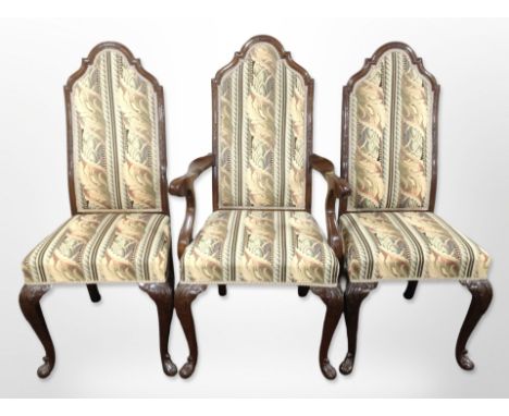 A set of six reproduction mahogany armchairs in the George III style in floral tapestry fabric.