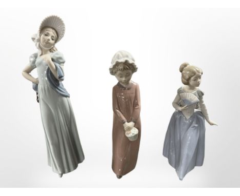 Three Nao figures of girls, all boxed.