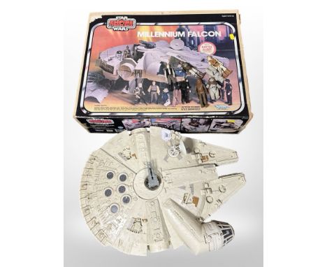 A Kenner Star Wars The Empire Strikes Back Millenium Falcon model, in original box, and several Star Wars figurines.