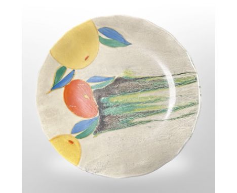 A Clarice Cliff for Wilkinson Ltd scalloped-edge plate decorated with fruit, diameter 20cm.