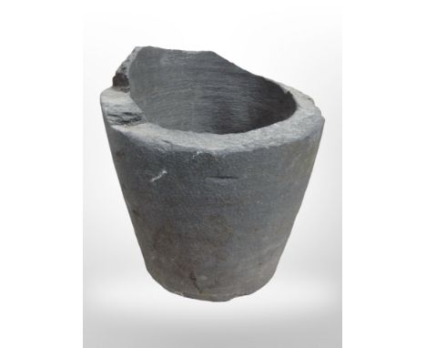 A stone garden planter, height 40cm.