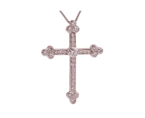 A diamond cross pendant on chain, collet-set with a round brilliant-cut diamond at the centre, on pavéd-set arms terminated w