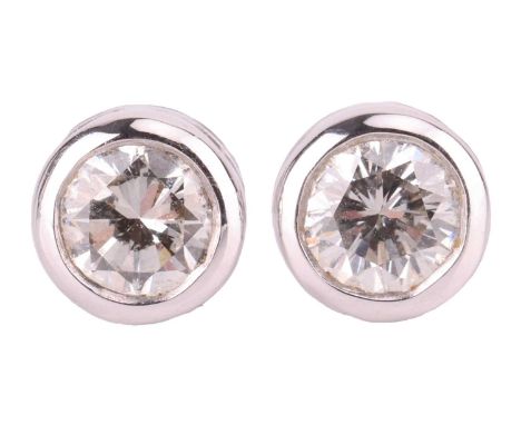 A pair of diamond stud earrings, bezel-set with round brilliant-cut diamonds, measuring approximately 3.6mm each, with an est