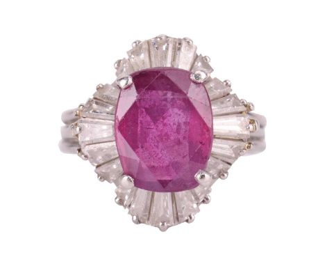 A ruby and diamond ballerina ring, featuring a cushion-cut ruby of 10.9 x 8.5 x 4.3 mm, claw-set within a ruffle surround enc