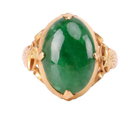 A jade dress ring, featuring a deep green jadeite cabochon of 14.6 x 10.0 x 3.8 mm, in a cut-down collet between openwork fol