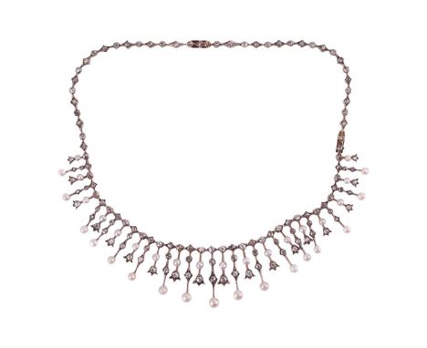 An Edwardian diamond and pearl fringe necklace, set with rose-cut and old-cut diamonds in cut-down collets and tulip mounts, 