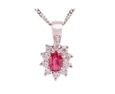 A ruby and diamond cluster pendant on chain, the oval-cut ruby of 5.9 x 4.1 mm, claw-set within a surround set with ten round