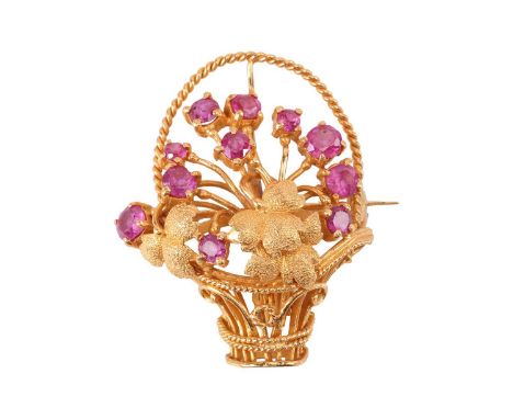 A ruby-set giardinetti brooch, with textured leaves in a twisted cable wicker basket, emanating eleven circular-cut rubies de