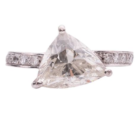 A modified trilliant-cut diamond ring, the diamond of 3.58ct in a claw setting, between pavé-set diamond shoulders leading to