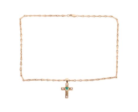 An emerald and diamond cross pendant on chain, the pendant centred with a collet-set shield-shaped emerald, and arms highligh