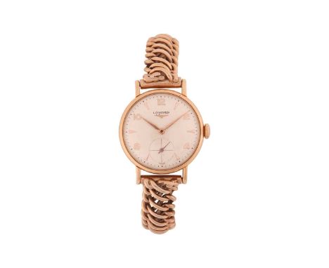 A Longines 9 Carat Ladies WristwatchYear: 1960/70sCase Material: 9 Carat Gold Case Diameter: 24mmDial: Silvered Numerals: Ara