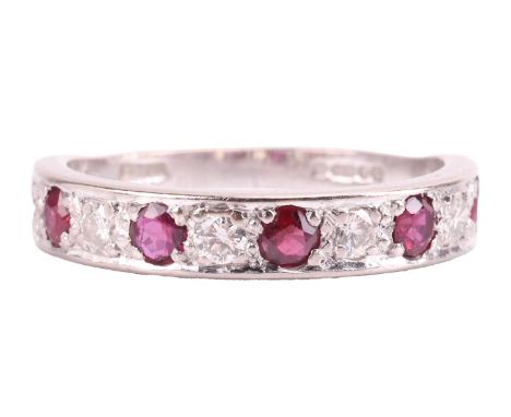 A ruby and diamond half-eternity ring in 18ct white gold, alternating with five circular-cut rubies and five brilliant-cut di