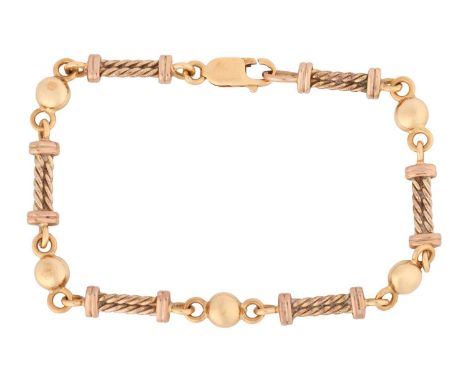 A fancy link bracelet, comprising a series of twisted rope design links, flanking circular button-shaped spacers, to a lobste