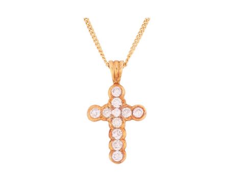 A diamond cross pendant on chain, the pendant of cruciform collet set with eleven brilliant-cut diamonds, with an estimated t