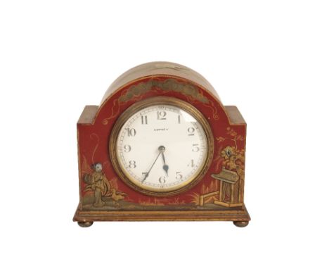 A RED JAPANNED MANTEL CLOCK retailed by Asprey, with a white enamel dial in a domed case decorated in shades of gilt with chi