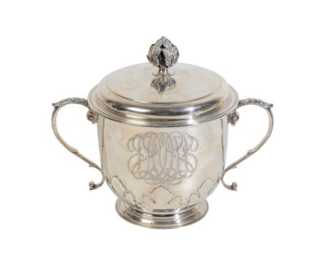 A GEORGE V SILVER CUP AND COVER BY C.S.HARRIS &amp; SONS LTD., London 1911, the circular cup with an applied leaf motif, acan