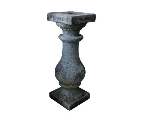 A GRANITE BALUSTER PEDESTAL, Early 20th century, probably previously a sundial plinth, with applied metal lettering around th