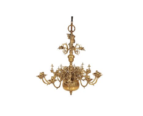 A LARGE BRASS TEN LIGHT CHANDELIER IN DUTCH 18TH CENTURY STYLE, 19th century, with hanging ring above a figural finial cast a