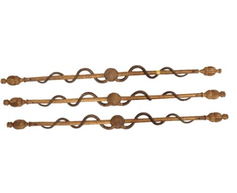 A SET OF THREE EMPIRE PAINTED AND PARCEL GILT CURTAIN POLES, early 19th century, each carved with twin serpents entwined arou