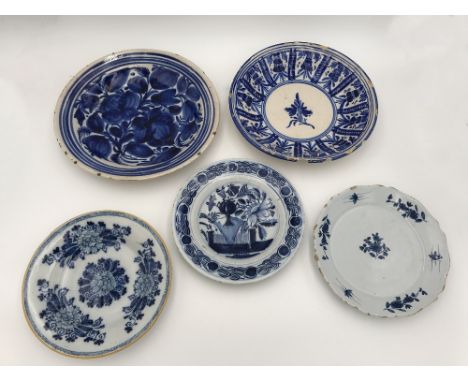 A DUTCH DELFTWARE BLUE AND WHITE PLATE 18th/19th century, decorated with a vase of flowers within a formalised floral border,