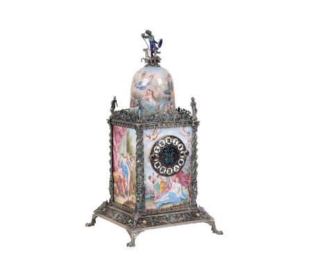 AN ENAMELLED SILVER COLOURED METAL DESK TIMEPIECE, PROBABLY VIENNESE, The domed top with figural finial above a square sectio