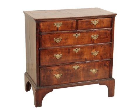 A GEORGE II WALNUT AND CROSSBANDED CHEST OF DRAWERS, Second quarter 18th century and later elements, the two short and three 
