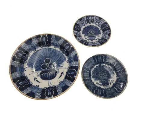 A DUTCH DELFTWARE BLUE AND WHITE CHARGER, 18th/19th century, with peacock pattern decoration of a jardiniere containing feath
