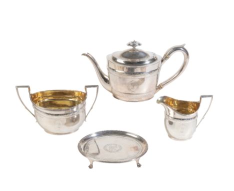 A GEORGE III SILVER THREE PIECE TEA SERVICE BY JOHN EMES, London 1799, the oval teapot with chased foliate bands and a looped