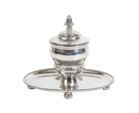 A DANISH SILVER INKWELL AND STAND BY GEORG JENSEN Copenhagen, circa 1925-32, .830 standard, no. 145, the baluster inkwell wit