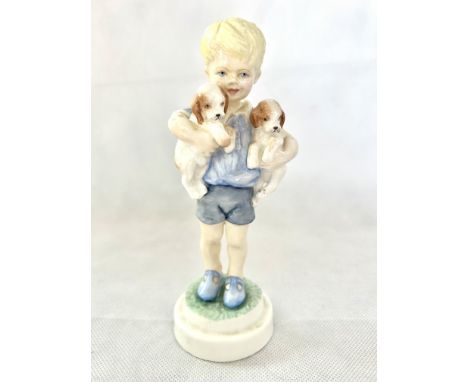 Royal Worcester figure of a boy hugging two puppies
