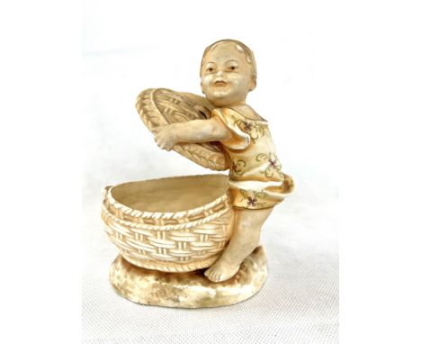 Ceramic figure of boy with basket 