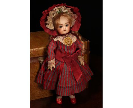 A Pintel &amp; Godchaux (France) bisque head Bébé doll, the bisque head with inset fixed blue glass eyes, painted features in