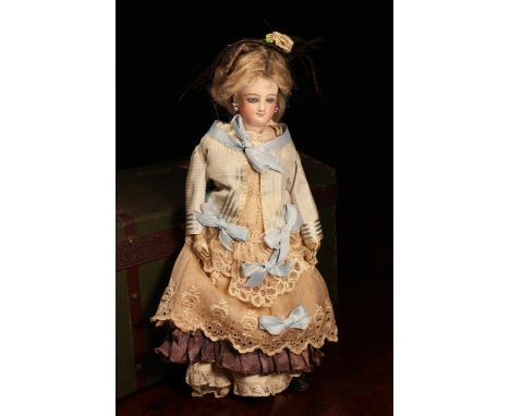 A 19th century Bru Jne &amp; Cie (France) bisque shoulder and bisque head French Poupée de Mode or fashion smiling doll, the 