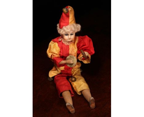 A Gebruder Knock (Germany) bisque head novelty 'automaton' type doll, in the form of a Jester, the bisque head with inset fix