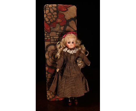 A Fleischmann &amp; Bloedel (Germany) bisque head and jointed painted composition bodied doll, of small proportions, the bisq