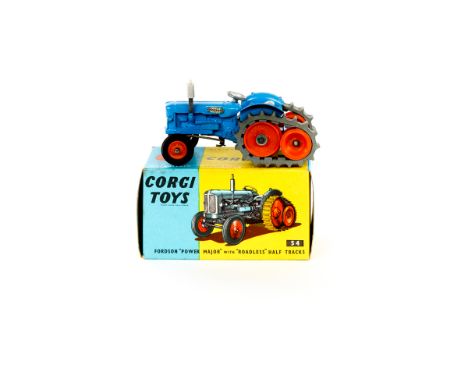 A scarce Corgi Toys Fordson 'Power Major' Tractor (54). An example with blue body, orange wheels and grey tracks. Boxed. Trac