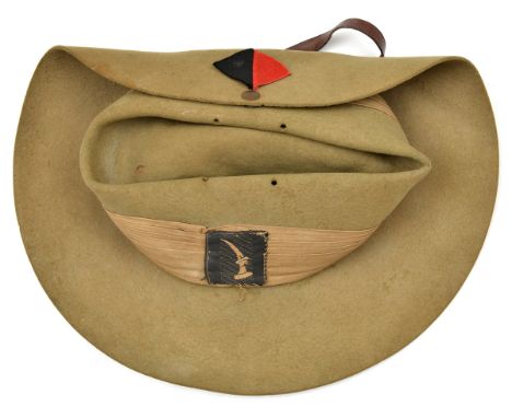 A scarce WWII slouch hat, with puggaree bearing Royal Artillery flash and patch white embroidered raised dagger on black fiel
