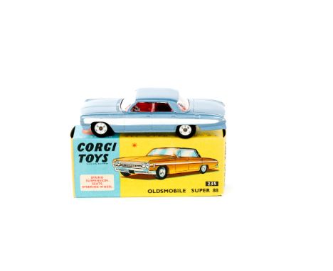 A Corgi Toys Oldsmobile Super 88 (235). An example in light metallic blue with white stripe and red interior. Boxed, minor we